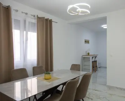 a dining room with a table and chairs at TWINS DREAMs HOUSE in Bar