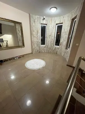 a room with a mirror and a tiled floor at Kodra Apartments in Ulcinj