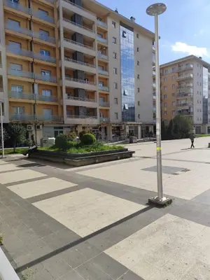 a street light in front of a large building at Apartman City kvart pg in Podgorica