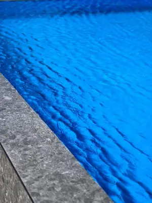 a close up of a pool of blue water at Lula Apartments in Ulcinj