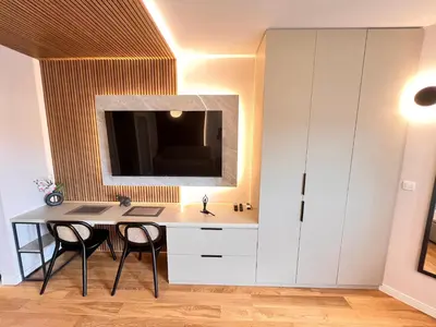 a bathroom with a vanity with a sink and a mirror at APART 28- Luxury suites in Podgorica