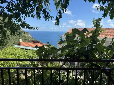 a view of the ocean from a house at Villa Happy Family in Seoca