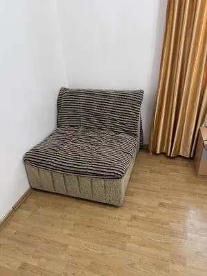 a bed sitting in a corner of a room at Villa Happy Family in Seoca