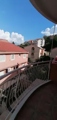 a metal railing on a balcony of a building at Marko Apartmani in Budva
