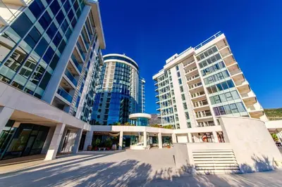 a group of tall buildings in a city at Luxury apart with 3 bedrooms in hotel near the beach in Budva