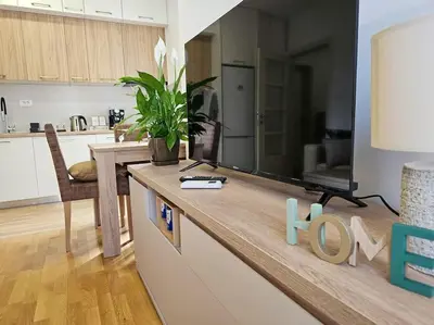 a kitchen with a counter with a tv on it at Blanc 1664 in Podgorica