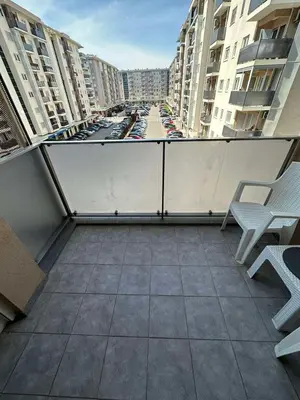 a balcony with a view of a city with buildings at Marija apartment City kvart in Podgorica