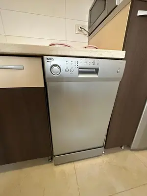 a kitchen with a dishwasher and a counter at Marija apartment City kvart in Podgorica