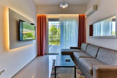 a living room with a couch and a table at SS Studio Oaza mira in Bar, Susanj