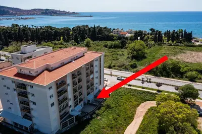 an aerial view of a building with a red arrow at SS Studio Oaza mira in Bar, Susanj
