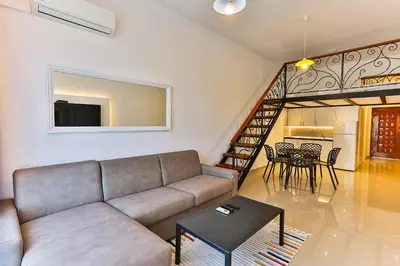 a living room with a couch and a table at SS Studio Oaza mira in Bar, Susanj
