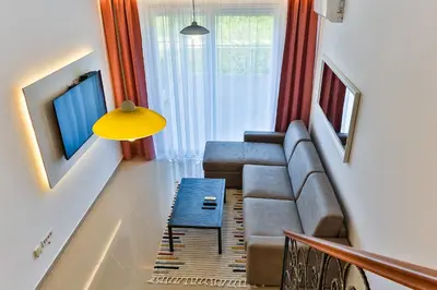 a living room with a couch and a table at SS Studio Oaza mira in Bar, Susanj