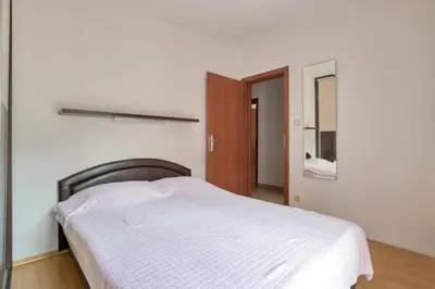 a bedroom with a white bed and a mirror at Underhill Royal View in Kotor