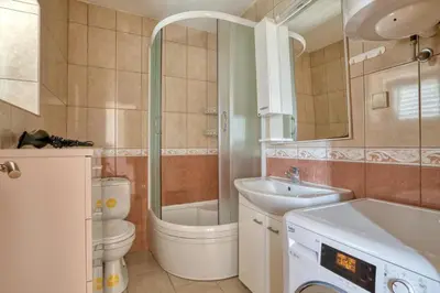a bathroom with a sink and a toilet and a shower at Underhill Royal View in Kotor