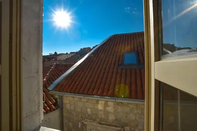 a view of a roof with the sun in the sky at PERFECT OLD TOWN SPOT in Budva in Budva