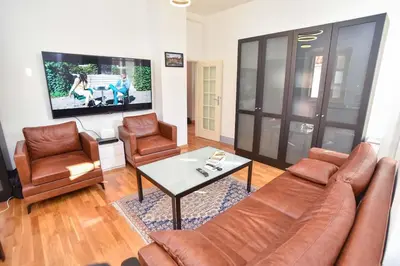 a living room with a couch and chairs and a tv at PERFECT OLD TOWN SPOT in Budva in Budva