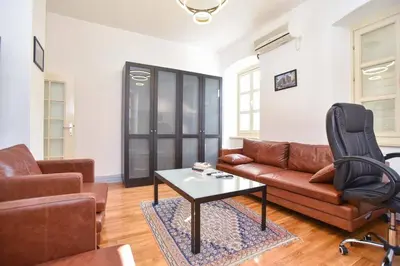 a living room with a couch and a table at PERFECT OLD TOWN SPOT in Budva in Budva