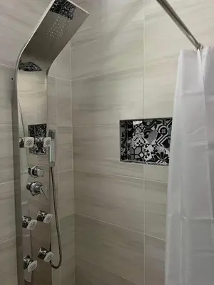 a bathroom with a shower with a shower curtain at Dado in Virpazar
