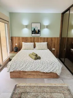 a bedroom with a large bed with two pillows at Sea Glass Kotor Bay in Škaljari