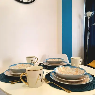 a table with plates and bowls of food on it at Four Views By The Sea Apartments in Budva