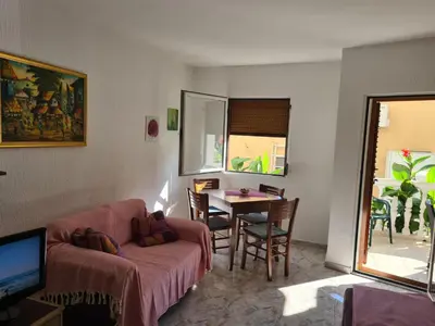 a living room with a couch and a table at Apartman Zvjezdana Dolina in Budva