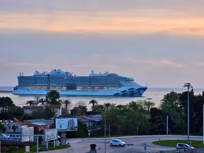 a large cruise ship in the water with a city at Kristina lux apartment in Bar