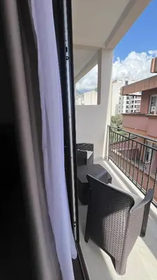 a balcony with a table and chairs on a balcony at Kristina lux apartment in Bar