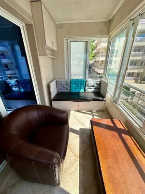 a living room with a couch and a chair and a table at Apple apartment Petrovac in Petrovac na Moru