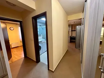 a hallway with a door leading to a kitchen at Apple apartment Petrovac in Petrovac na Moru