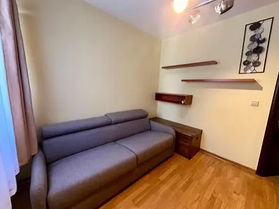 a living room with a couch in a room at Apple apartment Petrovac in Petrovac na Moru