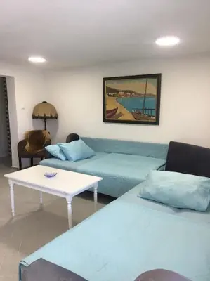 a living room with a couch and a table at Zinzula 2 in Bar