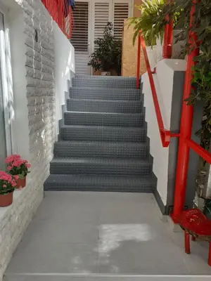 a set of stairs with a red hand rail at Zinzula 2 in Bar