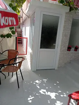 a door on a building with a table and chairs at Zinzula 2 in Bar