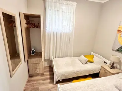 a bedroom with a bed and a window in it at My Choice in Budva
