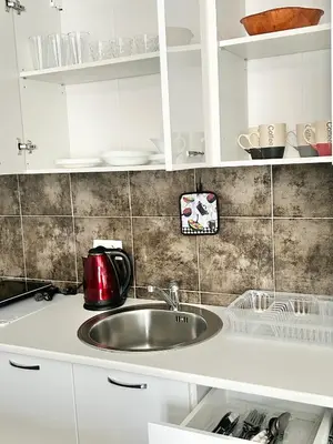 a kitchen sink with a red kettle on it at My Choice in Budva