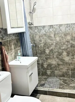 a bathroom with a shower and a toilet and a sink at My Choice in Budva