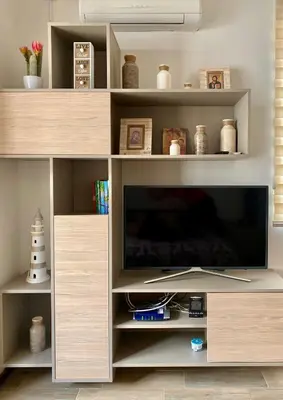 a large entertainment center with a television in a living room at Studio Prima-Modern Cozy Studio, 4 min to Beach in Pržno