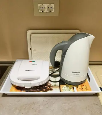 a coffee maker and toaster sitting on a tray at Studio Prima-Modern Cozy Studio, 4 min to Beach in Pržno