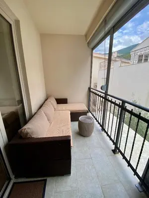 a living room with a couch and a balcony at Studio Prima-Modern Cozy Studio, 4 min to Beach in Pržno