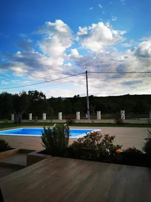 a view of a yard with a swimming pool at Visnjeva Gardens in Višnjevo