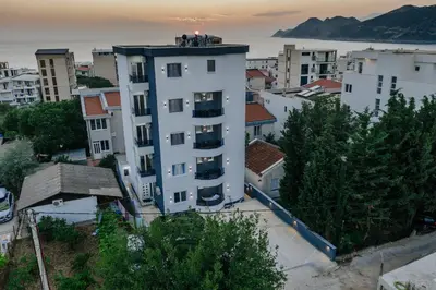 a group of people standing on top of a building at Lux DAM Apartments in Bar