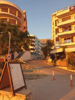 a sign on the side of a street with buildings at Lavender Apartment - Close to the Beach - Private Garage Parking in Dobra Voda