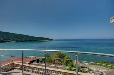 a view of the ocean from a balcony at Villa Blue Bay in Kruče