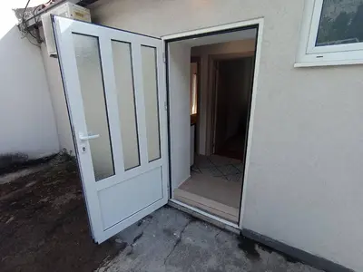 an open door leading into a room with a hallway at Apartmani Lakovic in Sutomore