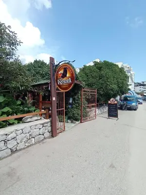 a gate to a restaurant with a sign on it at Apartmani Lakovic in Sutomore