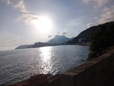 a body of water with the sun in the sky at Apartmani Lakovic in Sutomore