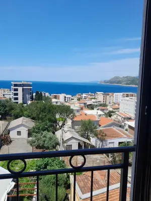 a view of the ocean from a balcony at Dubrava Czarnogóra in Dobra Voda
