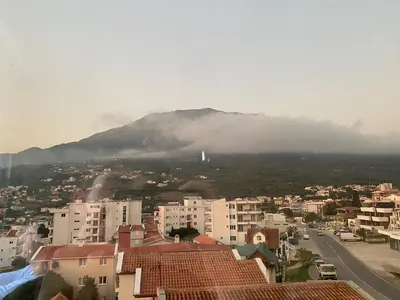 a view of a mountain from a city with buildings at Dubrava Czarnogóra in Dobra Voda