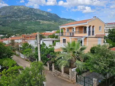 a view of a town with a mountain in the background at Villa Amela Dubrava in Bar