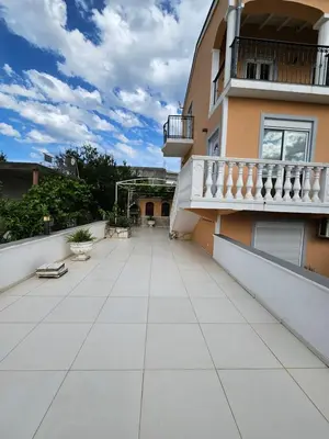 an empty courtyard of a building with a balcony at Villa Amela Dubrava in Bar